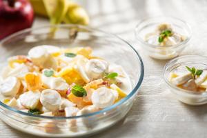 a glass bowl filled with fruit and ice cream at ANA Crowne Plaza Matsuyama by IHG in Matsuyama