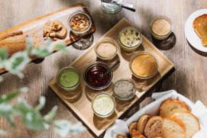 a table topped with different types of bread and dips at ANA Crowne Plaza Matsuyama by IHG in Matsuyama