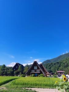 a farm house in the middle of a rice field at 一棟貸 風kaze in Ogaki