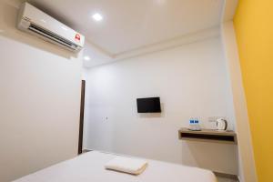 TV a/nebo společenská místnost v ubytování HomeStay 21 Hotel