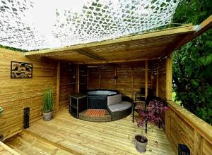 a wooden deck with aentedificialificialificialificialificialificialificialificialificialificial at Chez Flo&Fred Caravane Vintage in Barbery