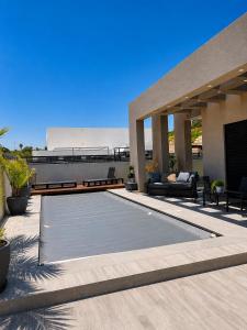 a swimming pool on the roof of a house at וילת צאלים in Yeroẖam