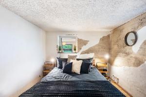 a bedroom with a large bed with blue sheets and pillows at Fewo Abendruh in Elzach