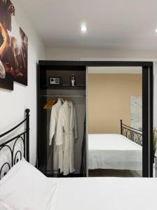 a bedroom with a mirror and a bed at La Dolce Vita in Piran