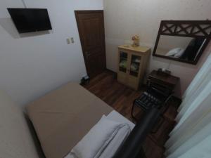 Кровать или кровати в номере Devega Homestay