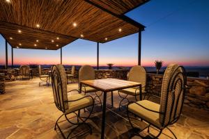 a patio with chairs and a table with a view at Rostock Ritz Desert Lodge in Cha-re