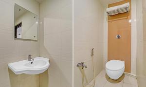 a bathroom with a sink and a toilet at Hotel G Square in Vijayawāda