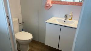 a bathroom with a white toilet and a sink at 住在巴黎 in Bondy +27 photos