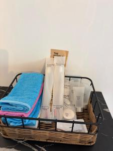 a basket with towels and other products on a table at Alisa Villa, Ubon Cottage in Ban Pla Duk +34 photos