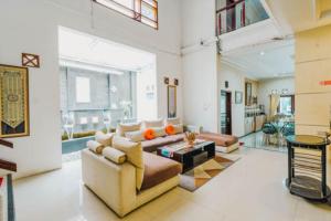 a large living room with a couch and a table at Aleyra Hotel and Villa's Garut in Garut