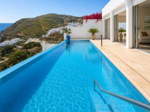 a pool in a villa with a view at Sensia Mediterranean Escape in Aouchtame