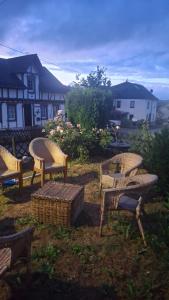 a group of chairs sitting in a yard at Ferienhaus am Ring in Wimbach