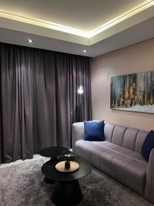 a living room with a couch and a table at The Residences at Crystal Towers in Cape Town