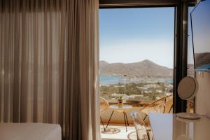 a hotel room with a view of the ocean at Apollonia Elounda View Villa in Elounda