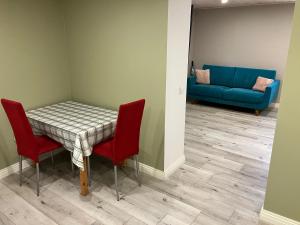 a room with a table and chairs and a couch at Arkaadia in Viljandi