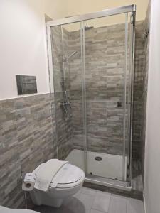 a bathroom with a shower and a toilet at Da zio Totò in Scilla