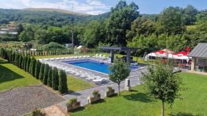 an overhead view of a swimming pool in a yard at Casa Maya in Săsciori