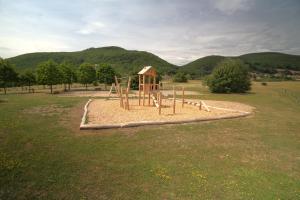 a playground in the middle of a field at Camping Les Vosges du Nord in Oberbronn