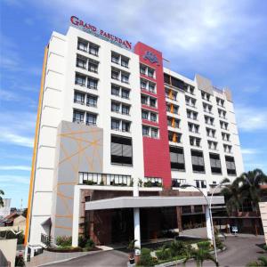 a hotel with a red and white building at Grand Pasundan Convention Hotel in Bandung