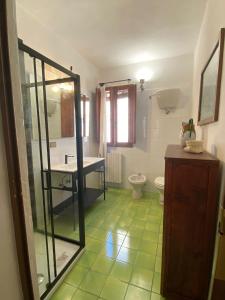 a bathroom with a sink and a toilet at S.M. L'ARCO in Monteriggioni +9 photos