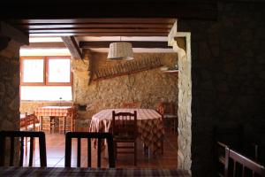 a dining room with a table and chairs at Mas Duran in La Pera