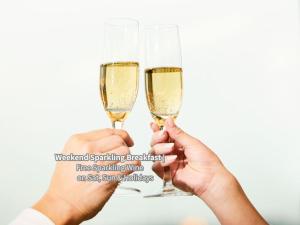 two people holding champagne glasses in their hands at Hotel Intergate Tokyo Kyobashi in Tokyo +55 photos