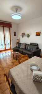 a living room with a couch and a table at Zorel House in Siena +14 photos