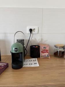 a green blender sitting on top of a table at Modern Luxury Apartment with Private Garage in Stara Varoš