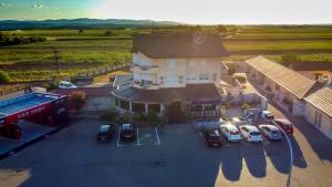 an aerial view of a building with cars parked in a parking lot at Motel Atos in Laktaši