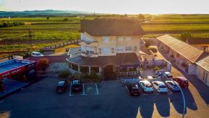 an aerial view of a building with cars parked in a parking lot at Motel Atos in Laktaši +67 photos