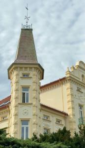 a building with a tower on top of it at Aparthotel František in Světlá nad Sázavou
