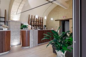 a lobby with a counter and a potted plant at Agriturismo Santa Rosa in Lubriano