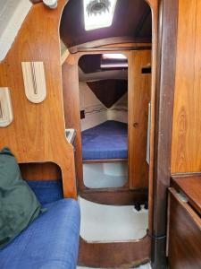a small room with a bed in the back of a boat at BoatMotel in Sainte-Marie-la-Mer