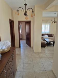 a kitchen and living room with a large tile floor at Villa Aggelos in Skala Sotiros