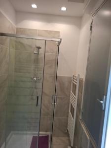 a shower with a glass door in a bathroom at Hotel Pierina in Castrocaro Terme +10 photos