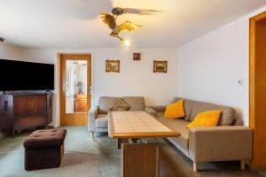 a living room with a couch and a table at Ferienhaus Adelheid in Bad Grund