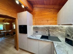 a kitchen with a sink and a counter top at Haus Martinus in Mayrhofen +43 photos
