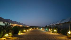 a long street with lights at night at Sam Sand Dunes Camps Jaisalmer in Sām