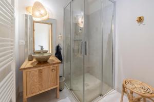 a bathroom with a sink and a shower at Gîte L'instant Vosges in Aydoilles +66 photos