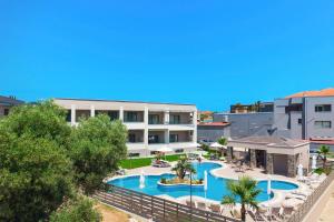 an aerial view of a resort with a swimming pool at Anẽse Vacation Feelings in Paliouri
