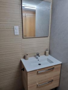 a bathroom with a sink and a mirror at pas de nom in Rosenwiller
