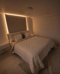 a bedroom with a large bed in a room at Sweet Escape et Jacuzzi Privé in Gonesse +17 photos