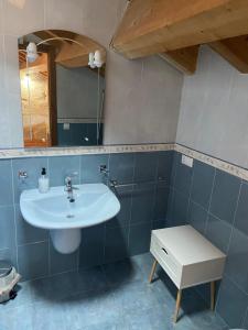 a bathroom with a sink and a mirror at Ático Seijas 6 in Tui