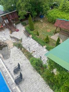 an aerial view of a patio with chairs and a pool at Ілона in Beregi