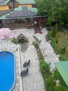 an aerial view of a patio with a swimming pool at Ілона in Beregi +6 photos