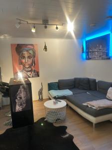 a living room with a couch and a table at Kolmio lähellä palveluita in Tampere
