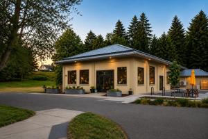 a house with a lot of windows on a street at Kwem Homes in Salem