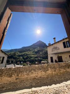a view of a mountain from a window of a building at Studio centre du village in Tende