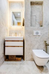 a bathroom with a sink and a toilet at Dalia Residence - Boutique Apartment in Sofia
