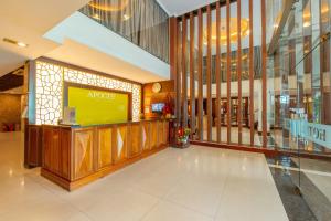 a lobby with a large screen in a building at Apogee Hotel in Ho Chi Minh City